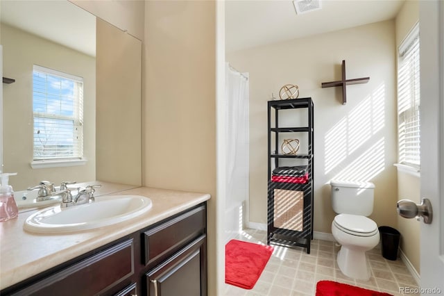 bathroom with visible vents, curtained shower, toilet, and vanity