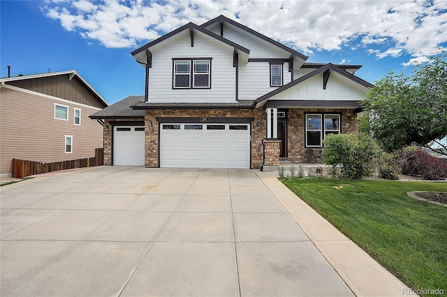 craftsman inspired home featuring a front yard and a garage