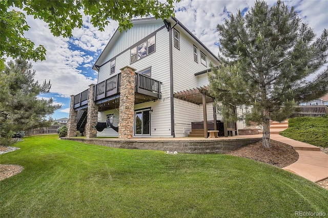 view of side of property with a balcony, a lawn, and a pergola