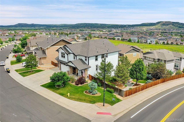 birds eye view of property featuring a mountain view