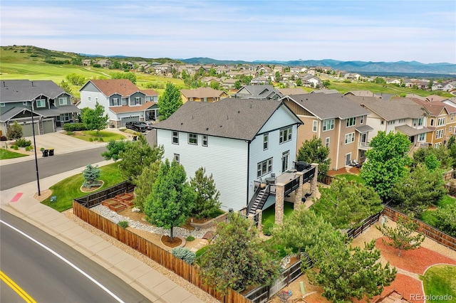 birds eye view of property with a mountain view