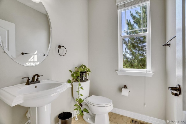 bathroom with sink, tile patterned floors, and toilet