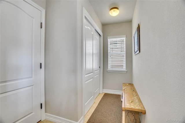 hallway with light tile patterned flooring