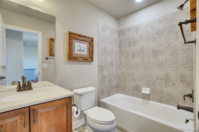 full bathroom with toilet, tiled shower / bath combo, and vanity