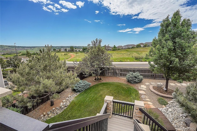 view of yard with a wooden deck and fence