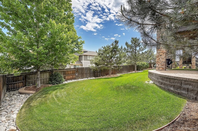 view of yard with a fenced backyard