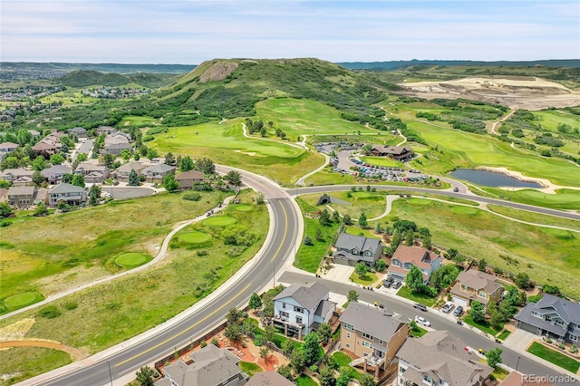 birds eye view of property with a residential view, golf course view, and a water view