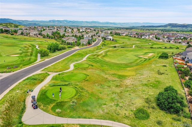 aerial view featuring a residential view, a mountain view, and view of golf course