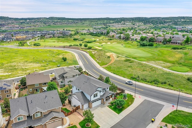 birds eye view of property with a residential view and golf course view