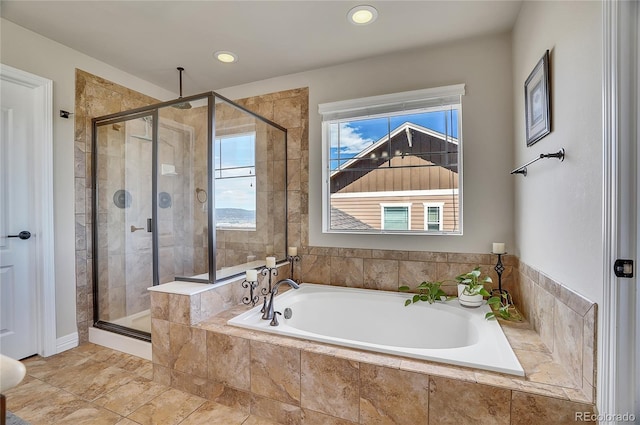 full bath featuring a shower stall, a bath, and recessed lighting