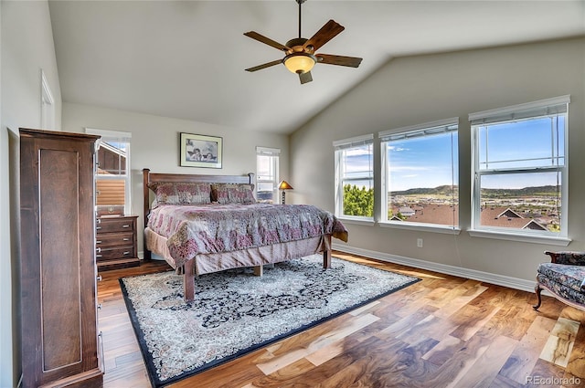 2314 Fairway Wood Cir, Castle Rock, CO 80109 - bedroom with vaulted ceiling, wood finished floors, baseboards, and a ceiling fan