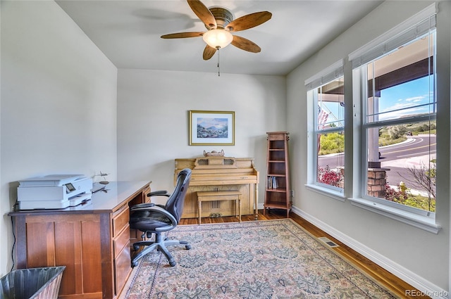 2314 Fairway Wood Cir, Castle Rock, CO 80109 - home office featuring wood finished floors, baseboards, and a ceiling fan