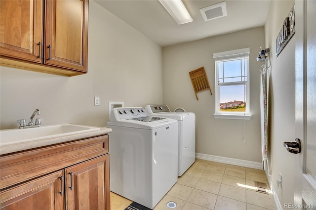 2314 Fairway Wood Cir, Castle Rock, CO 80109 - washroom featuring cabinet space, independent washer and dryer, baseboards, and light tile patterned floors