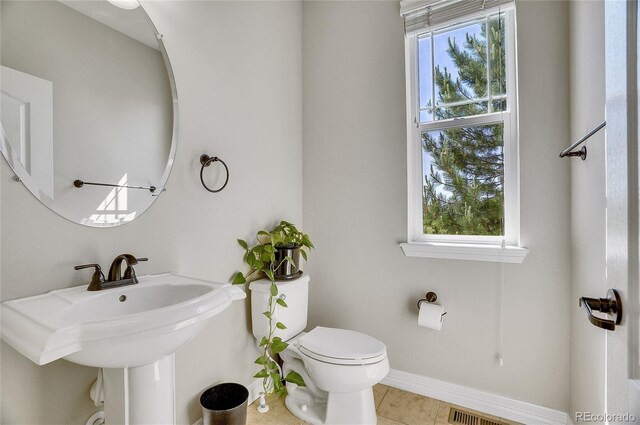 2314 Fairway Wood Cir, Castle Rock, CO 80109 - half bath with toilet, tile patterned flooring, baseboards, and a sink
