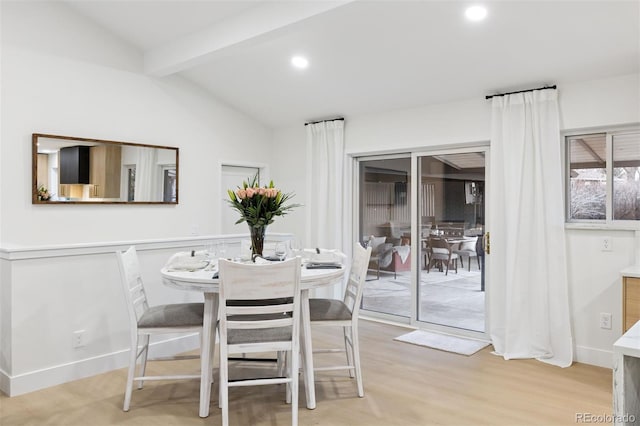 dining room featuring vaulted ceiling with beams, recessed lighting, baseboards, and light wood-style floors