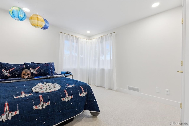 carpeted bedroom featuring baseboards, visible vents, and recessed lighting