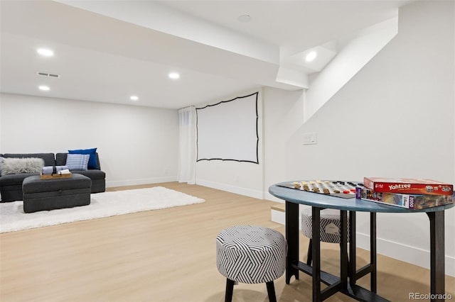 recreation room with light wood-type flooring, baseboards, visible vents, and recessed lighting