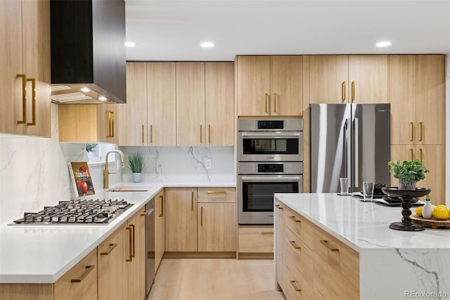 kitchen with appliances with stainless steel finishes and light brown cabinetry