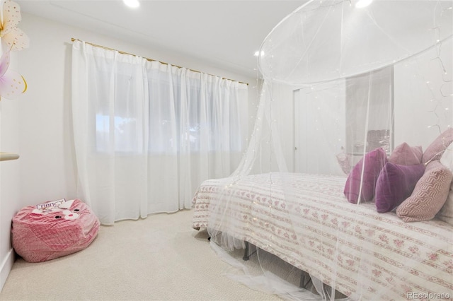 carpeted bedroom with recessed lighting