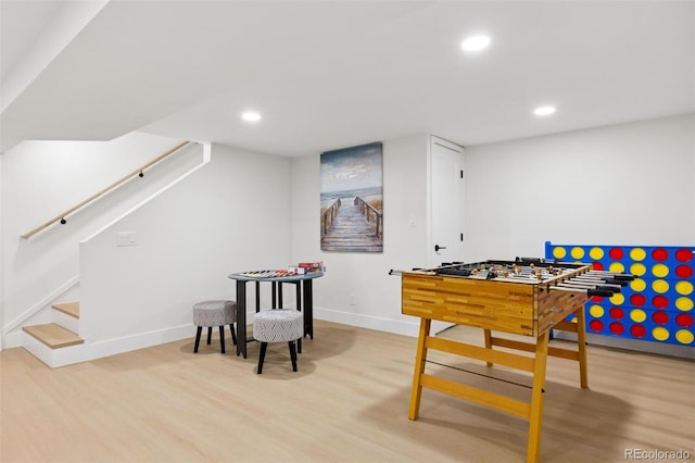 playroom featuring baseboards, wood finished floors, and recessed lighting