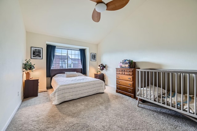 bedroom featuring baseboards, vaulted ceiling, ceiling fan, and carpet