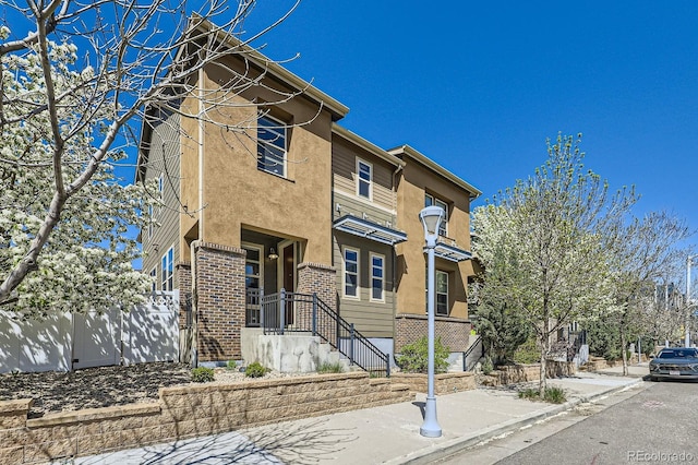 11323 Uptown Ave, Broomfield, CO 80021 - view of front facade featuring brick siding and stucco siding