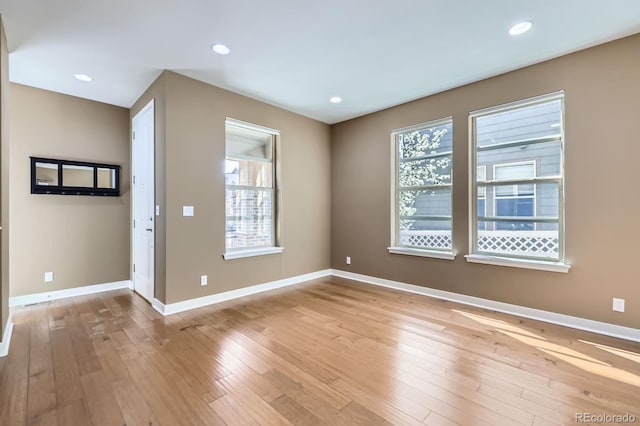 11323 Uptown Ave, Broomfield, CO 80021 - empty room featuring baseboards, a wealth of natural light, and light wood-type flooring