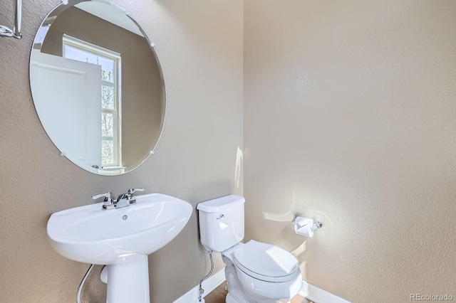 11323 Uptown Ave, Broomfield, CO 80021 - half bathroom featuring baseboards and toilet