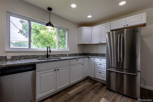 3256 S Ogden St, Englewood, CO 80113 - kitchen featuring appliances with stainless steel finishes, a sink, white cabinetry, dark wood-style flooring, and recessed lighting