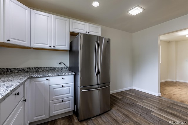 3256 S Ogden St, Englewood, CO 80113 - kitchen with freestanding refrigerator, dark wood finished floors, white cabinetry, and baseboards