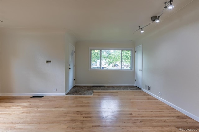 3256 S Ogden St, Englewood, CO 80113 - spare room featuring wood finished floors and baseboards