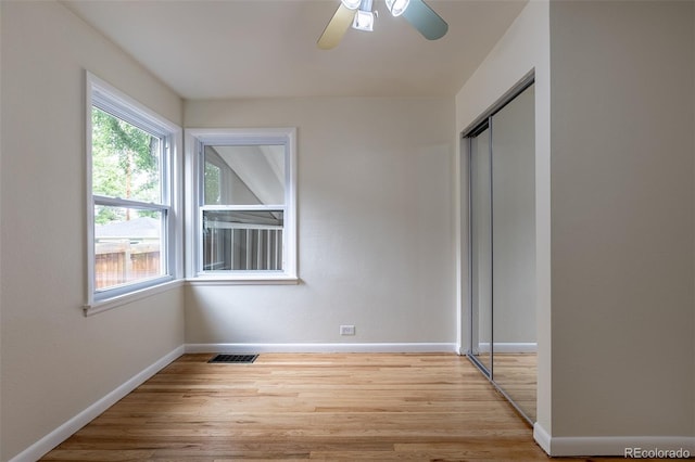 3256 S Ogden St, Englewood, CO 80113 - unfurnished bedroom with wood finished floors, a closet, baseboards, and ceiling fan