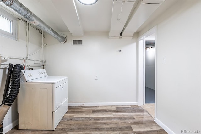 3256 S Ogden St, Englewood, CO 80113 - laundry room with washer / dryer, light wood finished floors, and baseboards