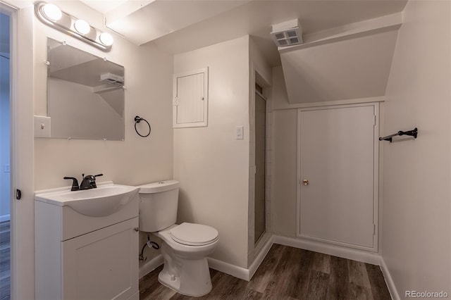 3256 S Ogden St, Englewood, CO 80113 - bathroom with baseboards, wood finished floors, vanity, toilet, and a shower
