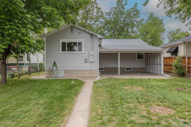3256 S Ogden St, Englewood, CO 80113 - back of property featuring a patio area and roof with shingles