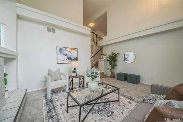 4807 Fenwood Dr, Highlands Ranch, CO 80130 - carpeted living area featuring stairs and a high ceiling