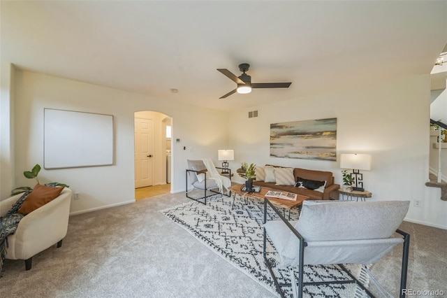 4807 Fenwood Dr, Highlands Ranch, CO 80130 - carpeted living area with arched walkways and ceiling fan