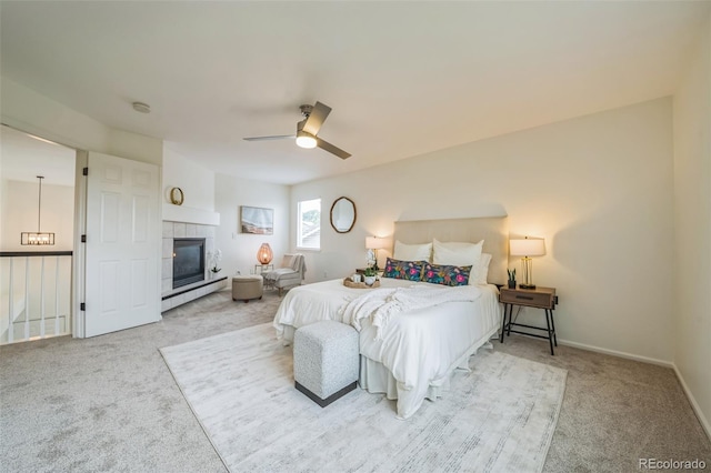 4807 Fenwood Dr, Highlands Ranch, CO 80130 - bedroom with carpet floors, a fireplace, a ceiling fan, and a baseboard radiator