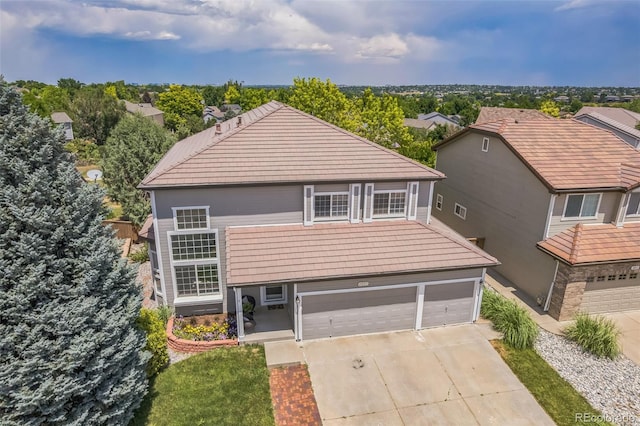 4807 Fenwood Dr, Highlands Ranch, CO 80130 - traditional-style home featuring a tile roof, concrete driveway, and a garage