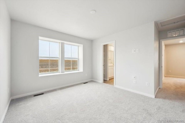 unfurnished bedroom with baseboards, visible vents, and carpet floors