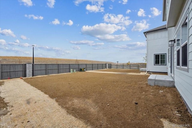 view of yard with a fenced backyard