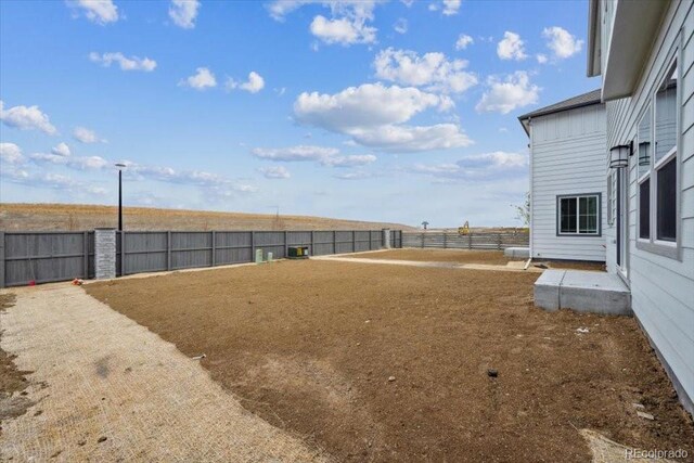 19089 E 94th Pl, Commerce City, CO 80022 - view of yard with a fenced backyard