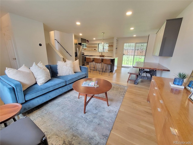 315 E 112th Dr, Northglenn, CO 80233 - living area featuring light wood finished floors, recessed lighting, and stairs