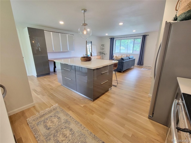 315 E 112th Dr, Northglenn, CO 80233 - kitchen with modern cabinets, freestanding refrigerator, gray cabinetry, light countertops, and recessed lighting