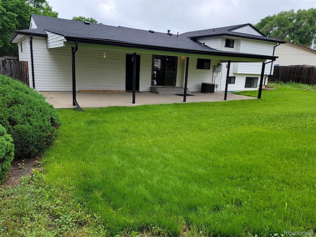 315 E 112th Dr, Northglenn, CO 80233 - back of property with a patio area and a shingled roof