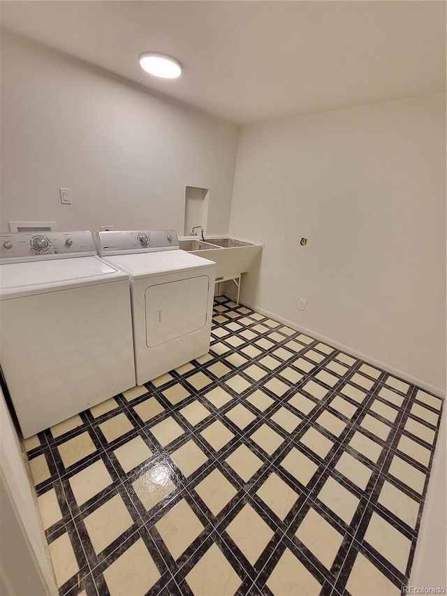 315 E 112th Dr, Northglenn, CO 80233 - laundry area featuring washing machine and clothes dryer and light flooring