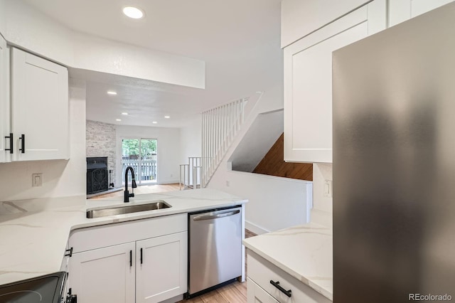 8197 S Fillmore Way, Centennial, CO 80122 - kitchen with dishwasher, a sink, light stone countertops, white cabinets, and recessed lighting