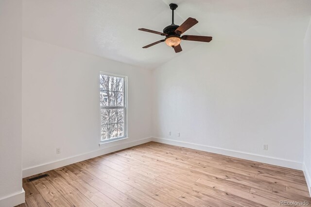 8197 S Fillmore Way, Centennial, CO 80122 - spare room with light wood-style flooring, ceiling fan, baseboards, and lofted ceiling