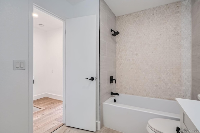 8197 S Fillmore Way, Centennial, CO 80122 - bathroom featuring toilet, vanity,  shower combination, and wood finished floors