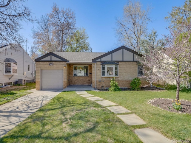 single story home featuring a garage, a front yard, driveway, and brick siding